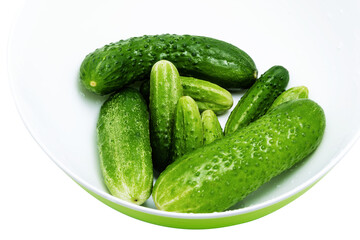 Cucumbers on a plate, white background
