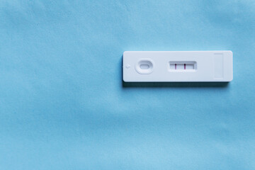 Pregnancy test on a  color background. Close-up. There is free space.