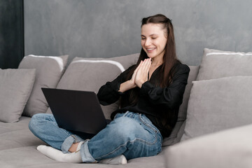 Happy woman having online video call at home