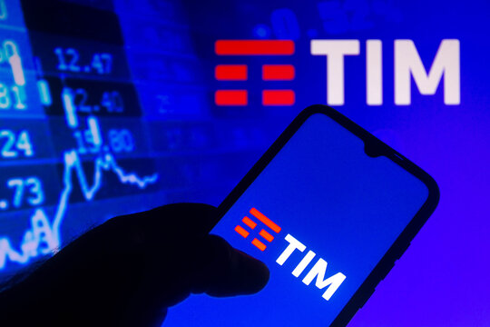 July 14, 2021, Brazil. In this photo illustration the TIM logo seen displayed on a smartphone with the stock market information in the background.
