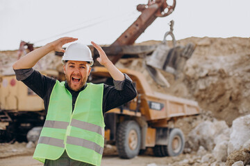 Male worker with bulldozer in sand quarry © Petro