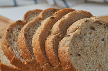 Sliced whole wheat bread on the wooden board