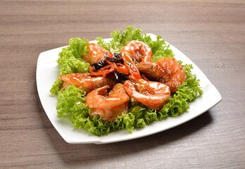 stir fried bbq tiger prawn seafood with Thai spicy chilli sweet sauce on wood background asian halal set lunch menu