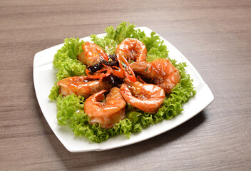 stir fried bbq tiger prawn seafood with Thai spicy chilli sweet sauce on wood background asian halal set lunch menu