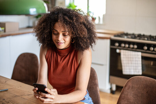 African American young adult female using smartphone