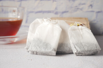 tea bag with small bag on table close up 