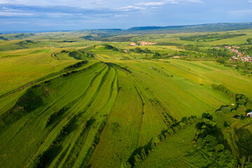 Aerial view of countryside vibrant green hills. Transylvania, Romania