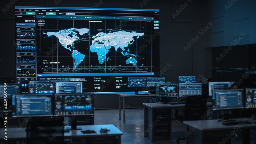 Poster Shot of a Big Empty Data Monitoring Center with Global Map on a Big Digital Screen. Center of Live Ananlysis Financial Stock Market Trading Info and Big Data.