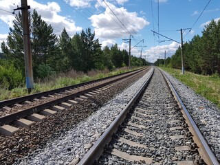 Fototapeta premium Railroad tracks reach the horizon