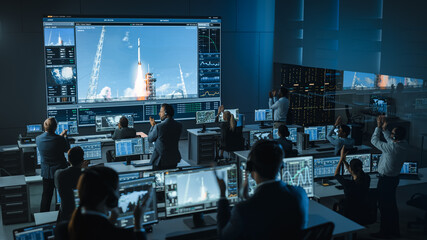 Group of People in Mission Control Center Witness Successful Space Rocket Launch. Flight Control...
