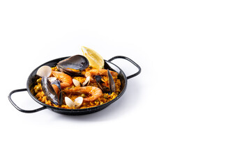 Traditional spanish seafood paella isolated on white background.	Copy space