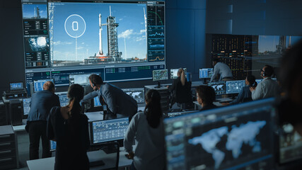 Flight Director Counts Down the Seconds Before Space Rocket Launch. Start. Team in Mission Control Witness Successful Lift Off. Flight Control Employees Sit in Front of Computers, Monitor the Mission.