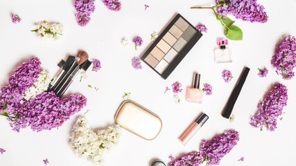 Different makeup cosmetics on white background with space for text