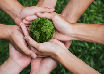 Earth Day. Hands adult Teamwork harmony Holding earth on hands. Environmental and reduce global...