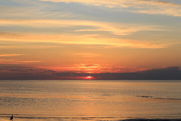 Fototapeta na wymiar orange sunset in the evening on the baltic sea