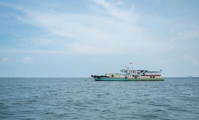 Tourism ship on the ocean and blue sky landscape,Travel boat concept for transport traveler in Thailand with beautiful sea and sky