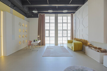 modern open-plan room interior in futuristic style in pastel colors with graphic wall decoration....
