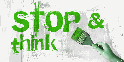 stop and think sign in green with paintbrush. lifestyle business eco concept
