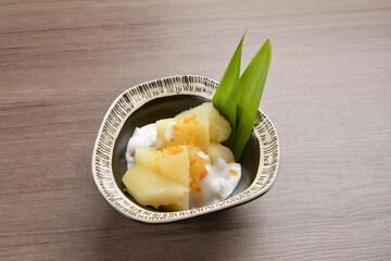 cold Tapioca with fresh coconut milk cream sauce dessert in bowl on wood table asian halal menu