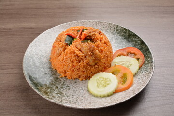 spicy chilli sambal chilli tomato wok fried rice nasi goreng on wood table asian halal menu