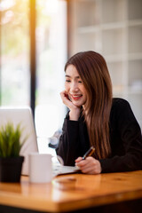 The double exposure image of business asian young woman working in coffee shop, Portrait business casual conceptual.