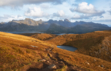 Beautiful view of the chocolate hills, lakes, sea and mountains at sunset on the lofoten islands in polar norway in autumn