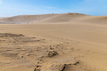 Beautiful landscape Tottori Sand Dunes (Tottori Sakyu), located near the city of Tottori in Tottori Prefecture, in sunny day with blue sky. They form the large dune system over 2.4 km in Sanin, Japan