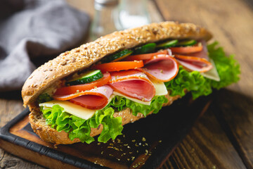 Large sandwich with ham, cheese and vegetables