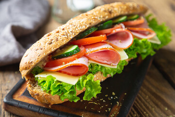 Large sandwich with ham, cheese and vegetables