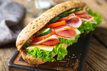 Large sandwich with ham, cheese and vegetables