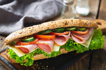 Large sandwich with ham, cheese and vegetables