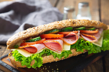 Large sandwich with ham, cheese and vegetables