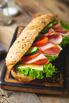 Large sandwich with ham, cheese and vegetables