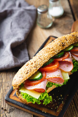 Large sandwich with ham, cheese and vegetables