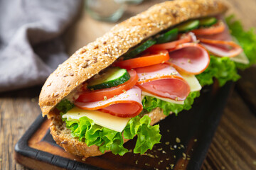 Large sandwich with ham, cheese and vegetables