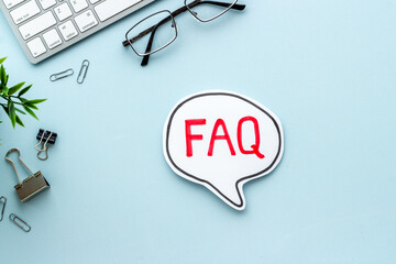 Business concept faq frequently asked questions on office table