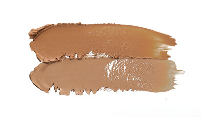 Gently beige strokes and texture of makeup foundation or acrylic paint isolated on white background