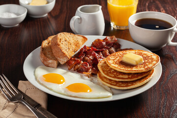 traditional full american breakfast eggs pancakes with bacon and toast