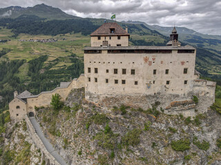 Drone view at Tarasp castle in the Swiss alps