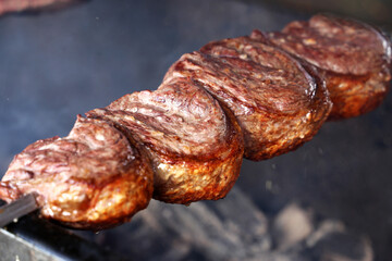 Picanha. Traditional Steak beef in Brazilian barbecue with fire background