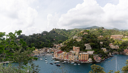 Fototapeta na wymiar View to the city of Portofino from near hill with sky and clouds