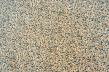 Abstract tile pattern, texture with small stones in light brown color