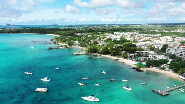 Aerial view, flight at beaches with luxury hotels with water sports and boats at Trou-aux-Biches Pamplemousses Region, Mauritius, Africa