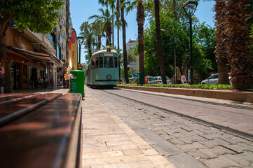 Fototapeta na wymiar Nostalgic tram and Antalya streets.