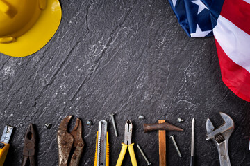 Top view design concept of American Labor Day with working tools.