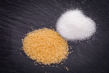 cane brown sugar on a dark stone background