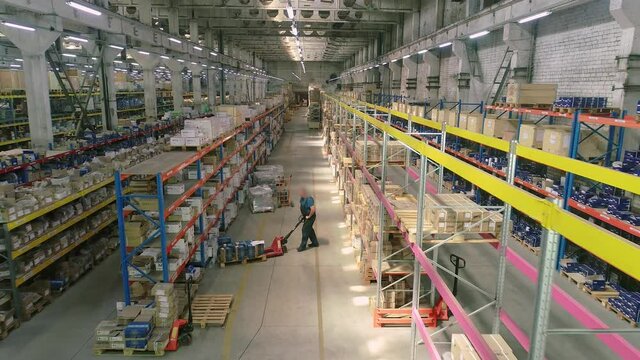 Large warehouse with cardboard boxes, a modern warehouse with boxes. Large modern warehouse with goods on shelves