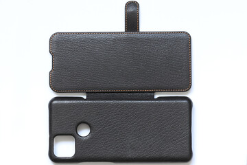Brown leather case for a book for a mobile phone. Skin texture. 