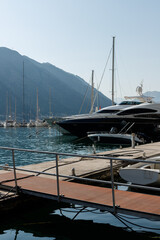 Fototapeta premium a modern yacht in the port of Kotor at sunset. Kotor. Montenegro 12.07.2021