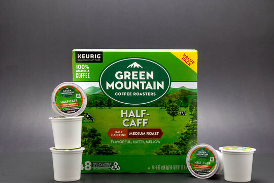 Fort Myers, FL, USA - 7-15-21: A box of Green Mountain Coffee Roasters Half Caffeine Medium Roast Coffee K-Cups Isolated on a black background These popular single serving pods were introduced in 1998